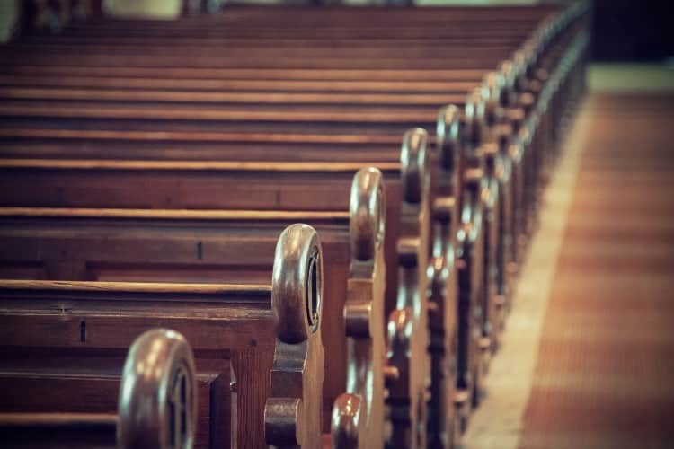 rows of wooden benches in church